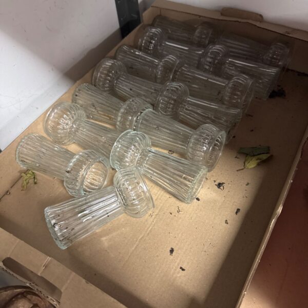 Lot of vintage clear glass hyacinth vases for floral displays.