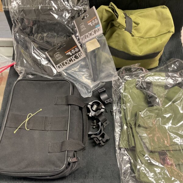 Glock 19 magazines and shooting accessories lot including bag and mounts.