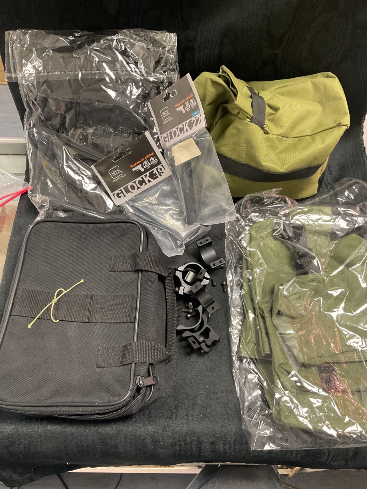 785 lot of new shooting items inc bags & two glock 19 mags and scope mounts