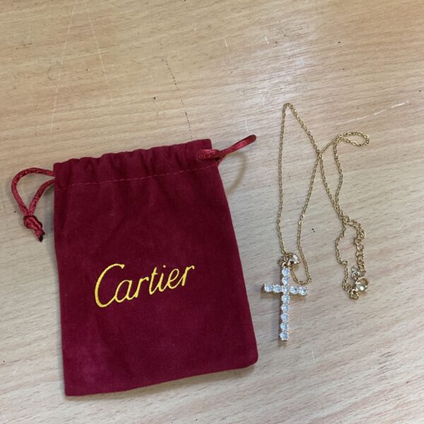 Vintage gold crucifix necklace in Cartier velvet pouch.