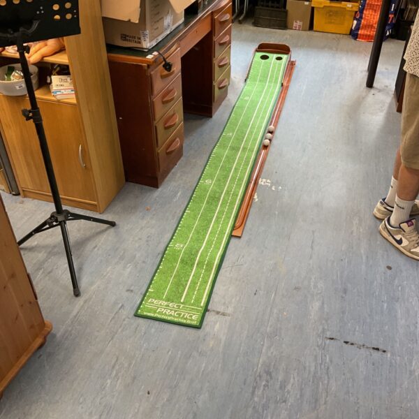 Perfect Practice Golf Putting Mat in a home setting.