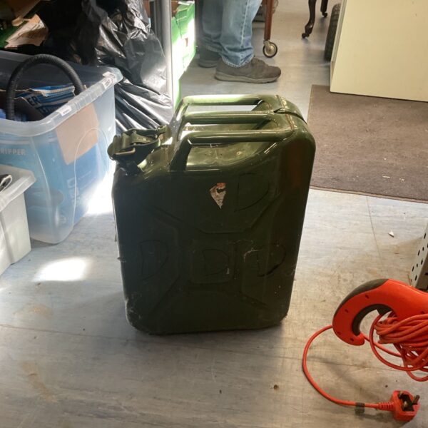 Green steel military jerry can for fuel or water storage.