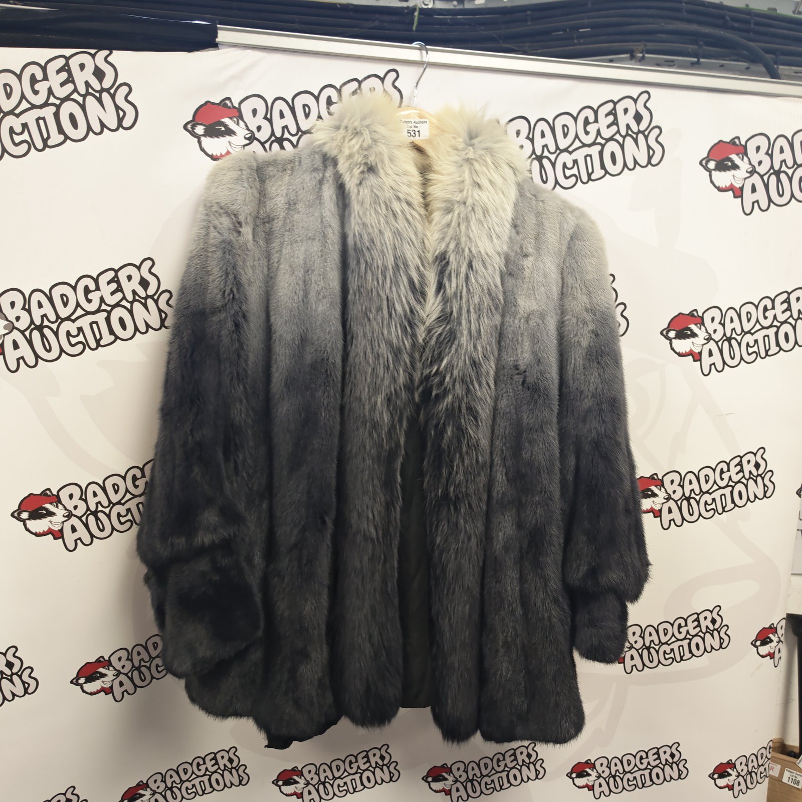 Stylish grey and white fur coat for winter wear.