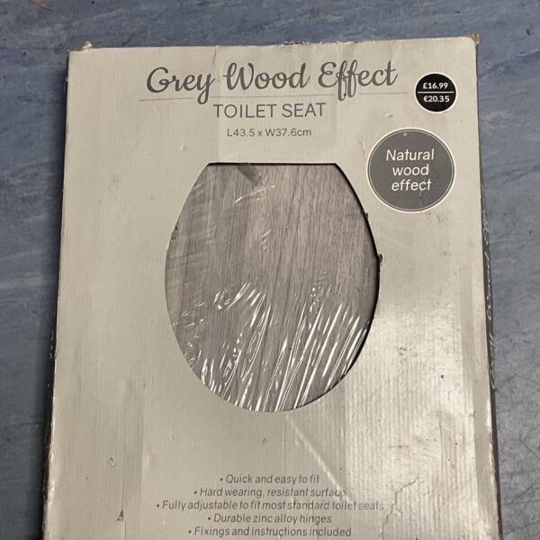 Grey wood effect toilet seat with dimensions 43.5cm x 37cm.