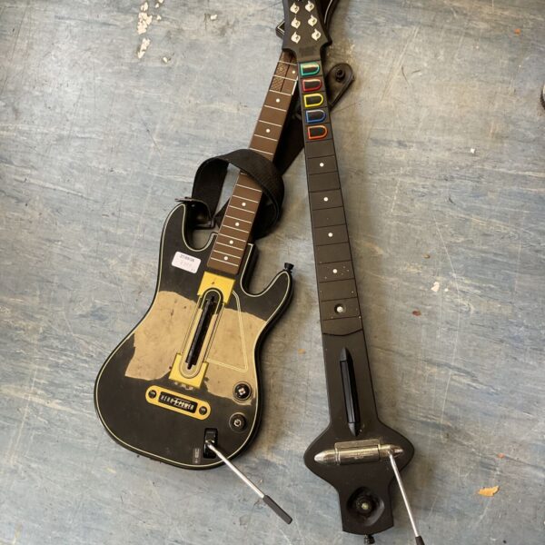 Guitar Hero guitar lot for music gaming collectors.