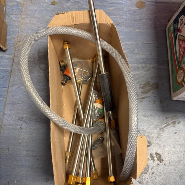 Gutter cleaning kit with curved lance and nozzles for pressure washer.