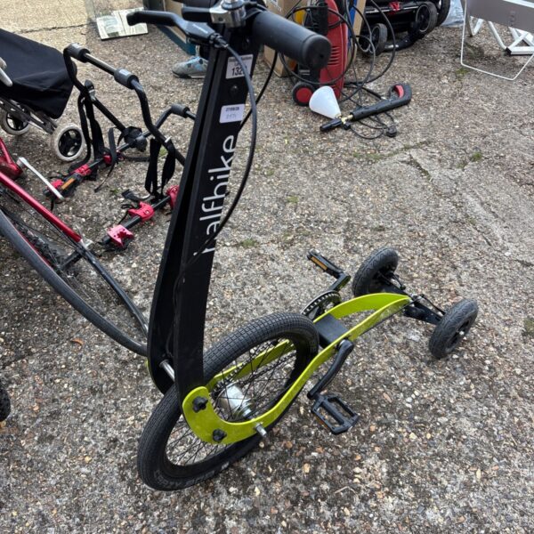 Vibrant halfbike, a unique three-wheel standing bicycle.