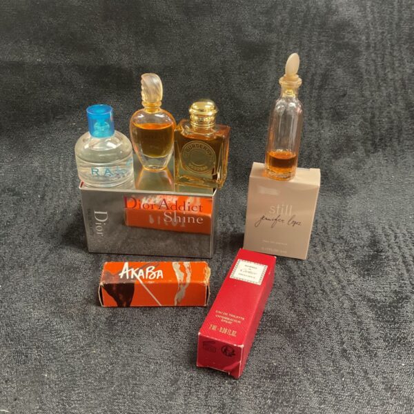 Collection of miniature handbag perfumes from Dior, Burberry, Cartier and Givenchy.