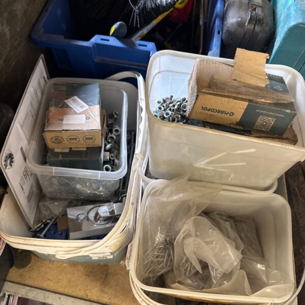 Assorted hardware lot including nails, bolts and a door latch.