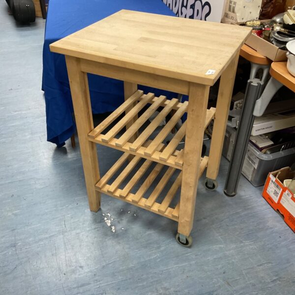 Hardwood BBQ table with casters, side view.