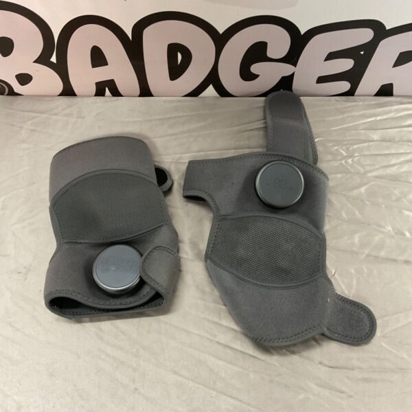 Pair of used heated knee pads with adjustable straps.