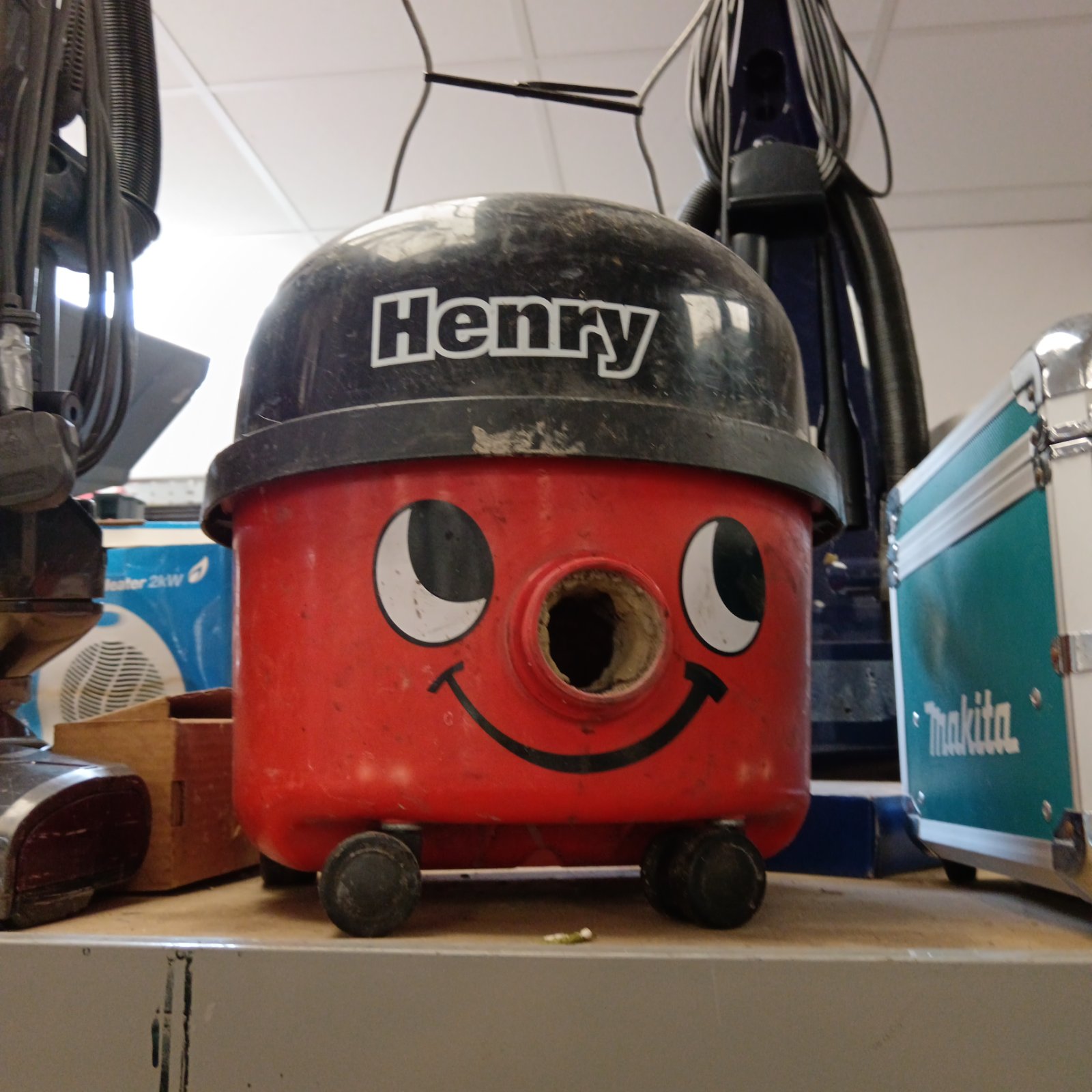 Red Numatic Henry vacuum cleaner body, vintage cleaning equipment.