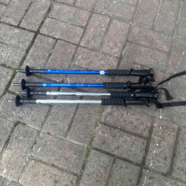 Lot of four extendable anti shock hiking sticks for outdoor adventures.