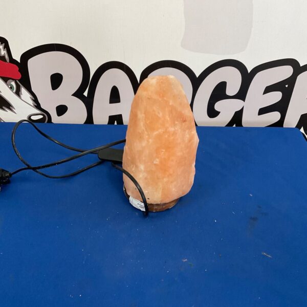 Illuminated Himalayan salt lamp with a warm glow.
