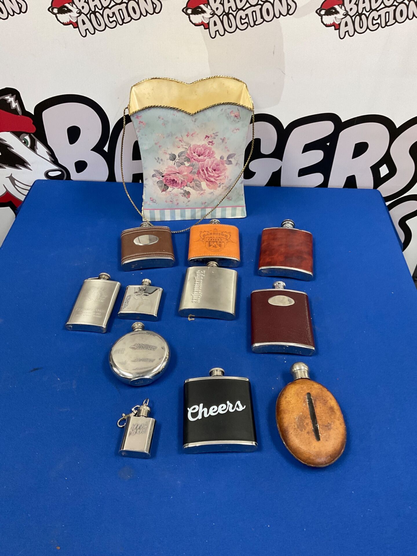 327 Basket of hip flasks