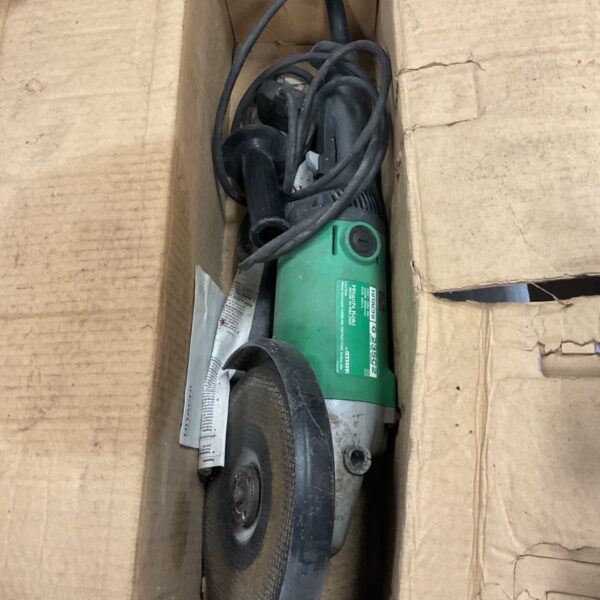 Side view of a used Hitachi angle grinder power tool.