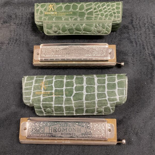 Vintage Hohner Chromonica harmonica set with green cases.