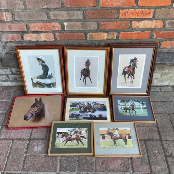 Collection of framed horse racing prints and photographs.