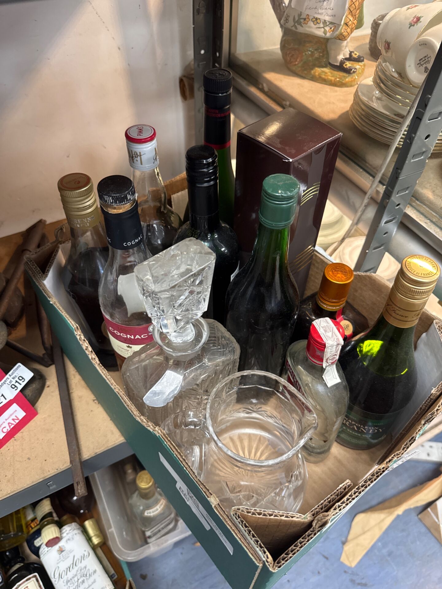 918 Box of house clearance booze, mostly part drunk inc cointreau etc with decanter & jug
