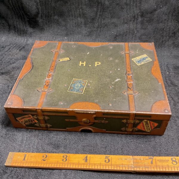 Vintage Huntley and Parmer biscuit tin shaped like a travel trunk.