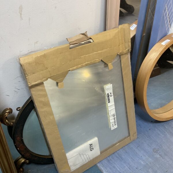 Ikea Alg mirror set with white frames, leaning against a wall.