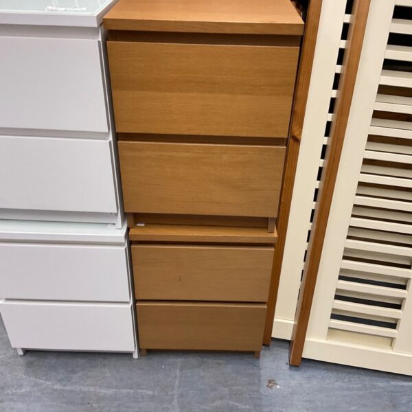 Pair of Ikea bedside cabinets with three drawers.