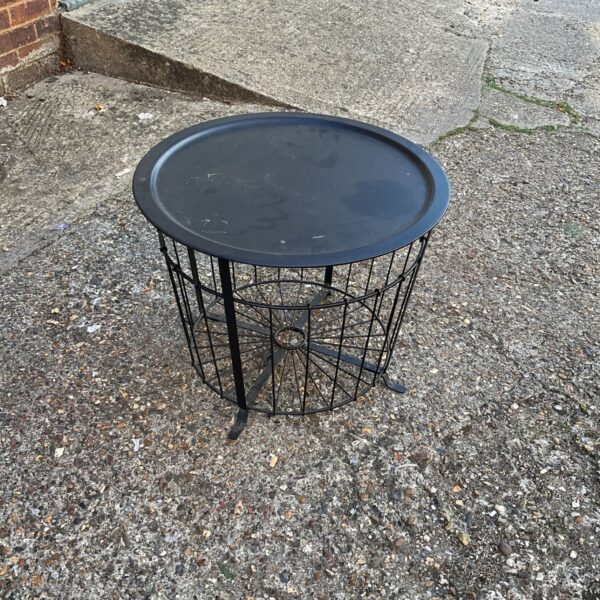 Circular IKEA metal coffee table with wireframe design.