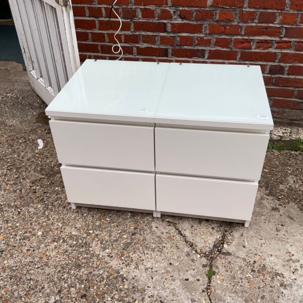 White Ikea Malm bedside cabinets, a pair for bedroom storage.