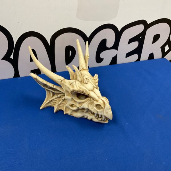 Detailed illuminated dragon head sculpture for fantasy decor.