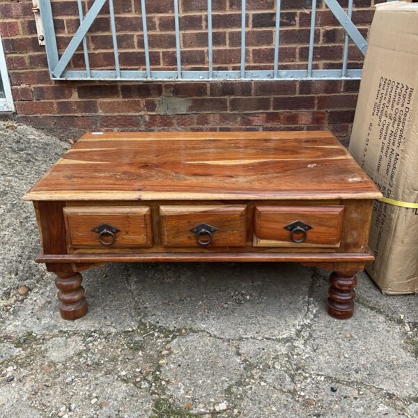 Vintage Indian oak coffee table with six drawers.
