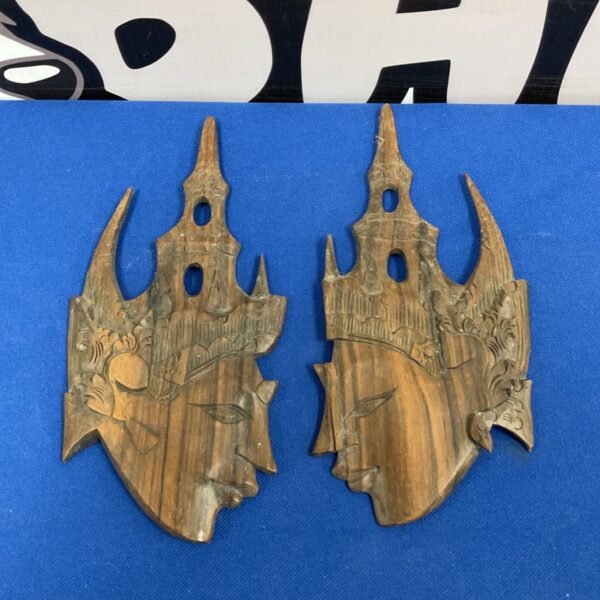 Vintage Indonesian deity wall plaques, detailed hand carved wood art.