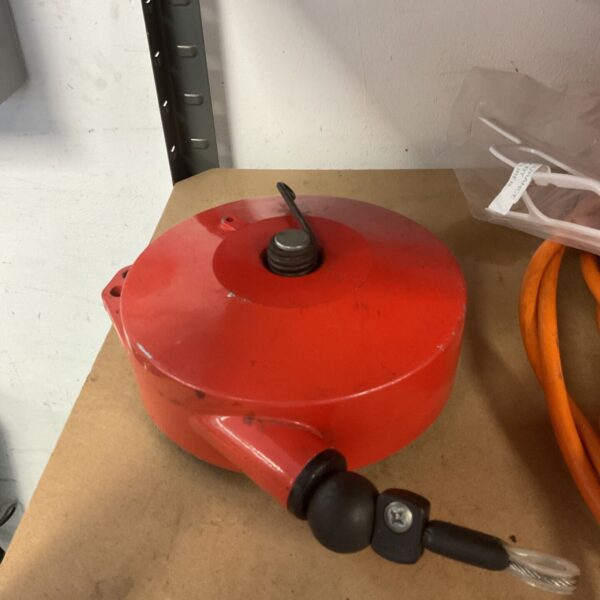 Red Ingersoll Rand cable balancer for industrial tool support.