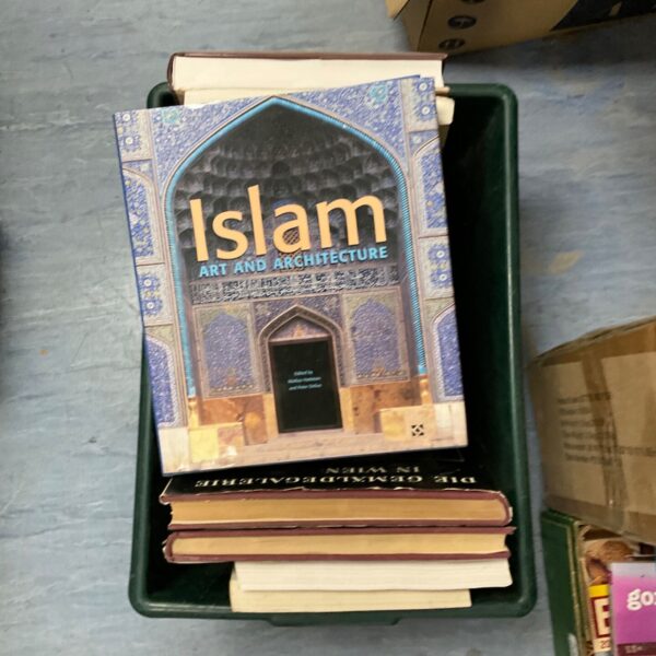 Stack of architectural reference books, including Islamic art and architecture.