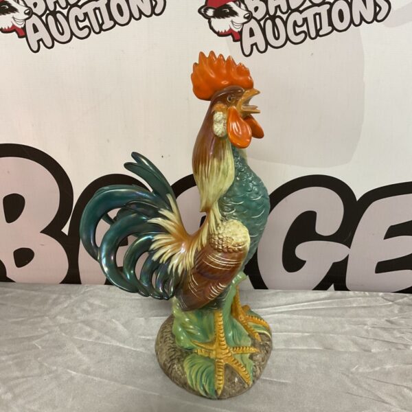 Colourful Italian ceramic rooster sculpture with green tail feathers.
