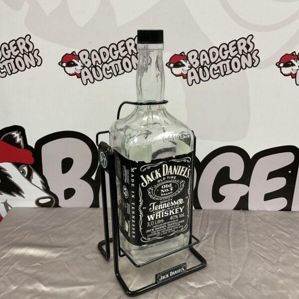 Large Jack Daniel's 3L whiskey bottle on pouring stand.