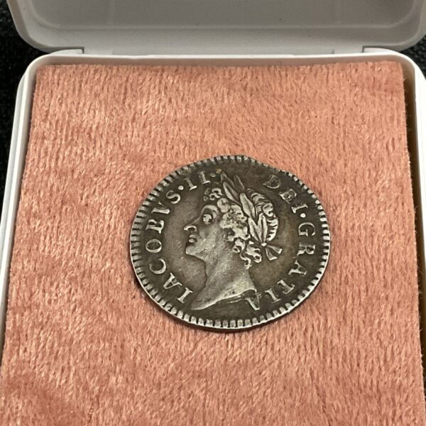 Silver James II Maundy coin from 1686, showing the king's portrait.
