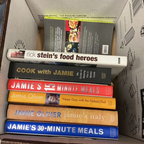 Lot of Jamie Oliver cooking books for kitchen inspiration.
