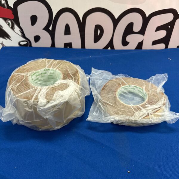 Two rolls of Jantac double sided carpet tape for flooring.