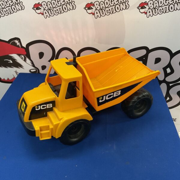 Yellow JCB dumptruck toy construction vehicle model.