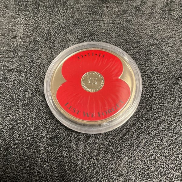 Jersey £5 Remembrance Day coin with poppy design.