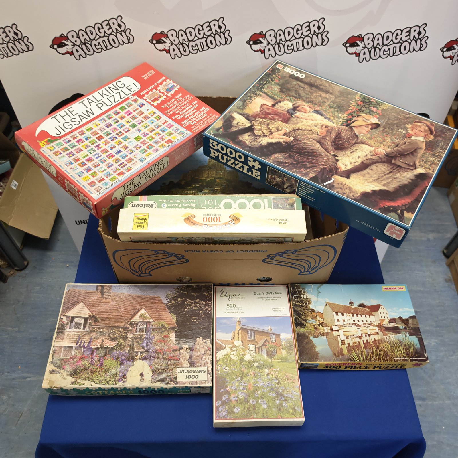 Assorted jigsaw puzzles including a 3000 piece puzzle.