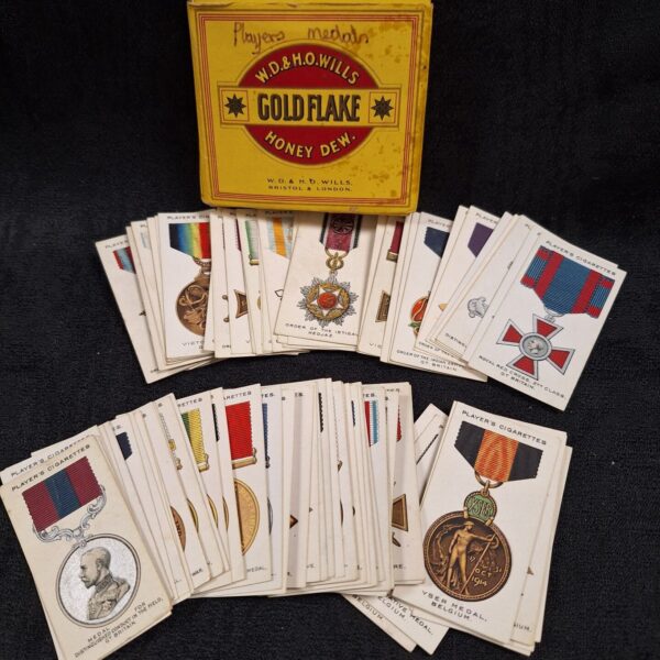 Vintage John Player cigarette card featuring a war decoration medal.