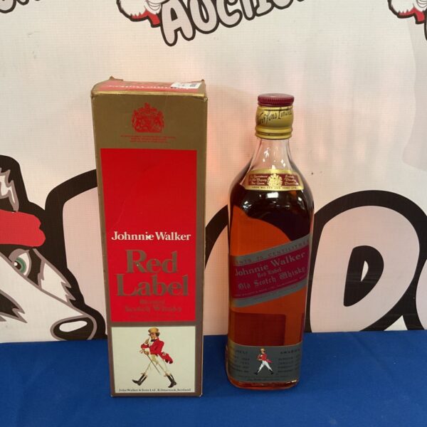 Sealed bottle of Johnnie Walker Red Label Scotch Whisky with box.
