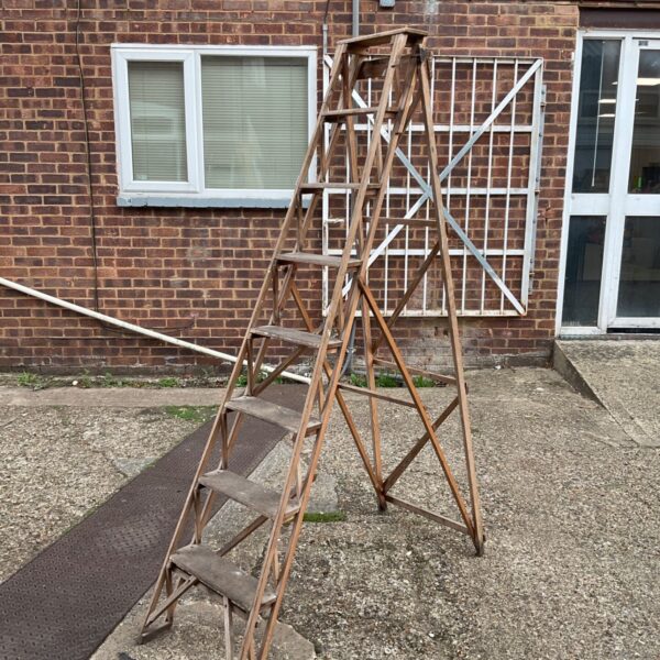 Vintage Jones wooden step ladder with five steps.