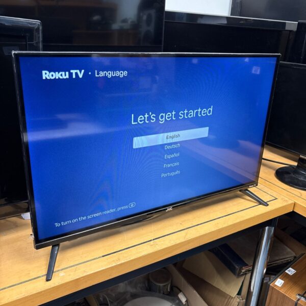 JVC 32 inch Roku Smart TV displaying the Roku home screen.