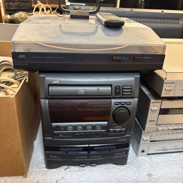 Vintage JVC stereo system with automatic turntable, a collectible audio component.