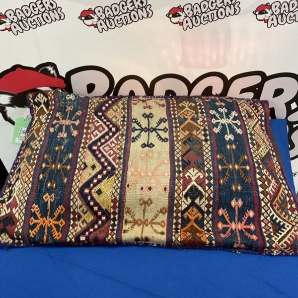 Vibrant Kilim throw pillow with woven geometric design.