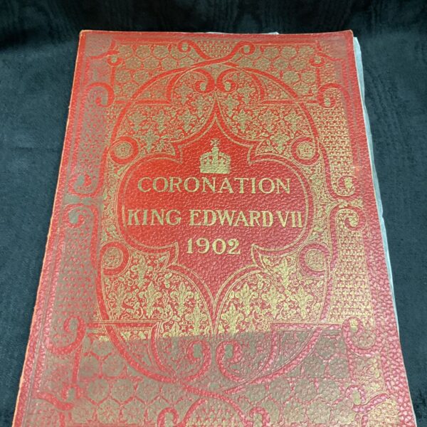 Antique red leatherette cover of King Edward VII coronation album.