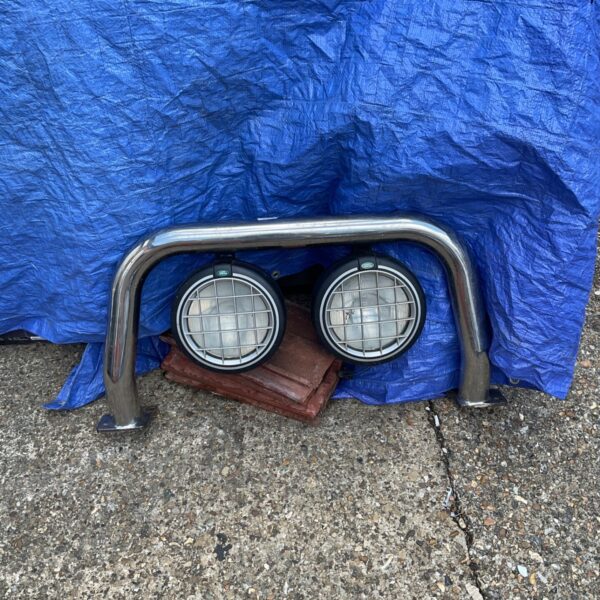 Land Rover chrome bumper with spot lights, vintage accessory.