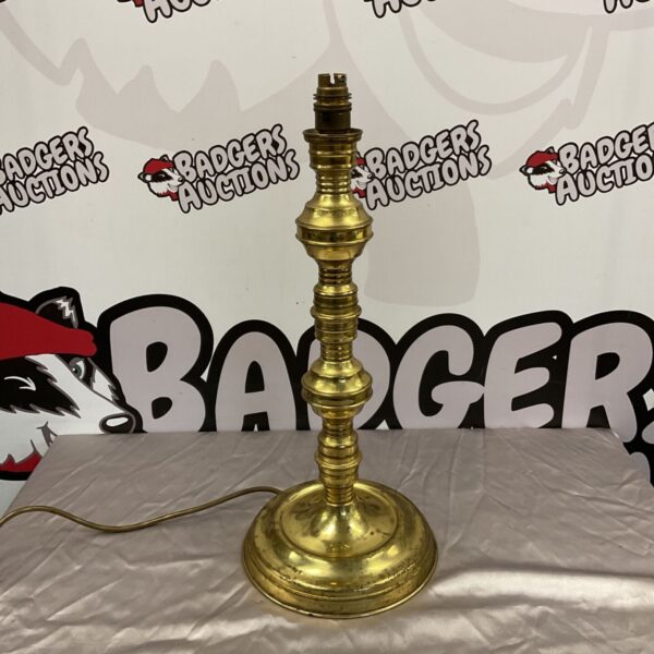 Vintage brass table lamp with a classic design and substantial base.